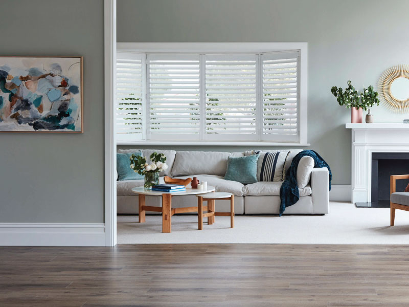 Cleaning timber Venetian blinds effectively with feather duster and eco-friendly solutions in Melbourne